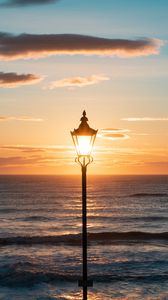 Preview wallpaper lantern, sea, horizon, sunset, clouds