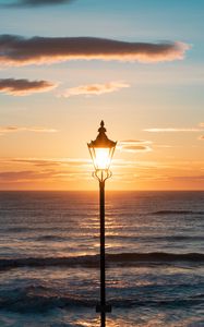 Preview wallpaper lantern, sea, horizon, sunset, clouds