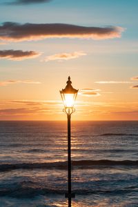 Preview wallpaper lantern, sea, horizon, sunset, clouds