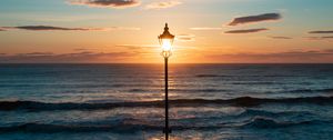 Preview wallpaper lantern, sea, horizon, sunset, clouds