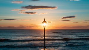 Preview wallpaper lantern, sea, horizon, sunset, clouds