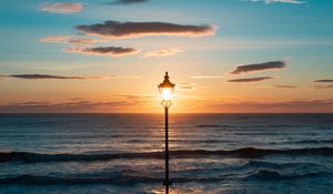 Preview wallpaper lantern, sea, horizon, sunset, clouds
