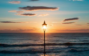 Preview wallpaper lantern, sea, horizon, sunset, clouds