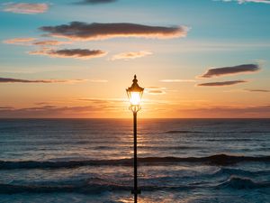Preview wallpaper lantern, sea, horizon, sunset, clouds