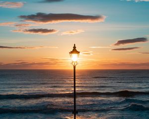 Preview wallpaper lantern, sea, horizon, sunset, clouds