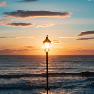 Preview wallpaper lantern, sea, horizon, sunset, clouds