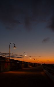 Preview wallpaper lanterns, road, evening, sunset