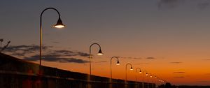 Preview wallpaper lanterns, road, evening, sunset