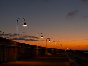 Preview wallpaper lanterns, road, evening, sunset