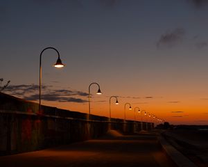 Preview wallpaper lanterns, road, evening, sunset