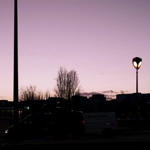 Preview wallpaper lanterns, trees, cars, buildings, sky, evening