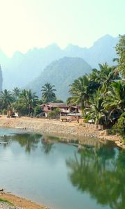 Preview wallpaper laos, tropics, palm trees, river, huts