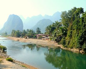 Preview wallpaper laos, tropics, palm trees, river, huts