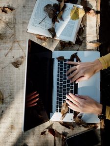 Preview wallpaper laptop, hands, work, leaves, autumn, aesthetics