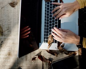 Preview wallpaper laptop, hands, work, leaves, autumn, aesthetics