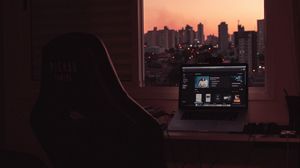 Preview wallpaper laptop, screen, desktop, desk, room, city
