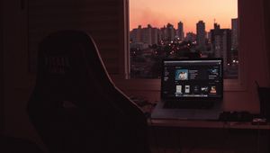Preview wallpaper laptop, screen, desktop, desk, room, city