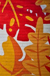 Preview wallpaper leaves, graffiti, bricks, surface, texture
