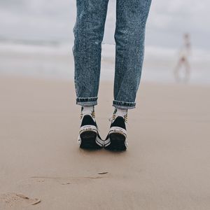 Preview wallpaper legs, beach, sand, person