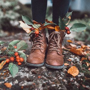 Preview wallpaper legs, boots, leaves, berries, autumn
