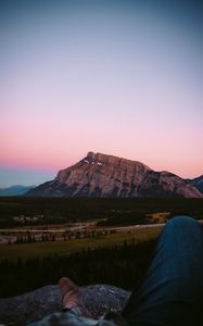 Preview wallpaper legs, boots, mountains, landscape, dusk