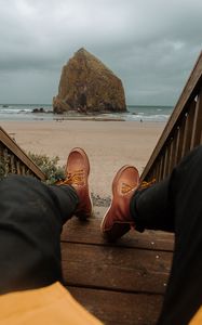 Preview wallpaper legs, boots, stairs, beach, rock