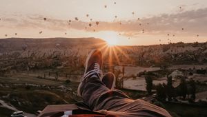 Preview wallpaper legs, landscape, sunset, air balloons, mountains, rest