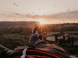 Preview wallpaper legs, landscape, sunset, air balloons, mountains, rest