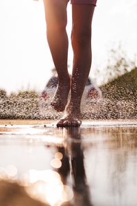 Preview wallpaper legs, puddle, spray, water, drops