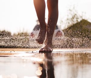 Preview wallpaper legs, puddle, spray, water, drops