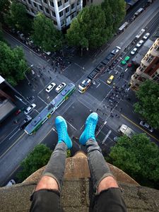 Preview wallpaper legs, roof, road, cars, buildings, aerial view