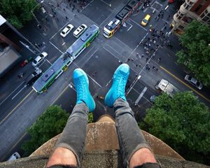 Preview wallpaper legs, roof, road, cars, buildings, aerial view