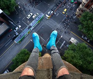 Preview wallpaper legs, roof, road, cars, buildings, aerial view