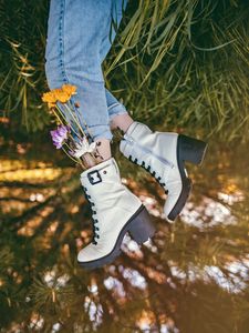 Preview wallpaper legs, shoes, flowers, jeans, grass