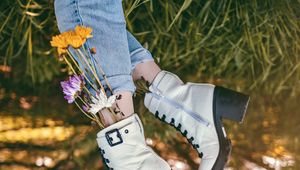 Preview wallpaper legs, shoes, flowers, jeans, grass