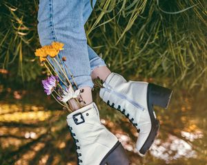 Preview wallpaper legs, shoes, flowers, jeans, grass