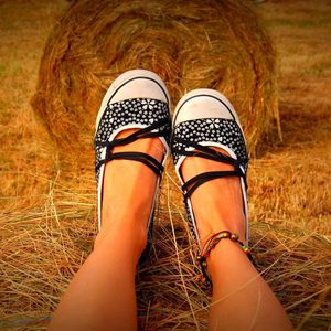 Preview wallpaper legs, shoes, hay, grass, sit