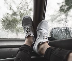 Preview wallpaper legs, sneakers, car, glass, rain