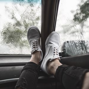 Preview wallpaper legs, sneakers, car, glass, rain