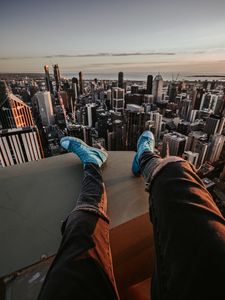 Preview wallpaper legs, sneakers, city, aerial view