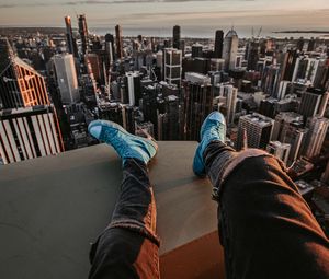 Preview wallpaper legs, sneakers, city, aerial view