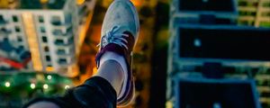 Preview wallpaper legs, sneakers, city, lights, aerial view