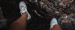 Preview wallpaper legs, sneakers, city, aerial view, coast