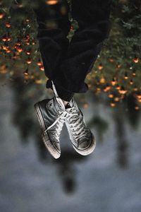 Preview wallpaper legs, sneakers, field, flowers, blur