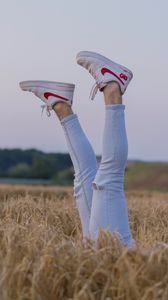 Preview wallpaper legs, sneakers, field, ears