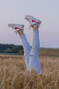 Preview wallpaper legs, sneakers, field, ears