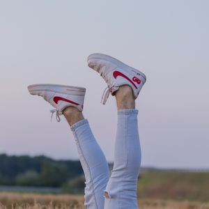 Preview wallpaper legs, sneakers, field, ears