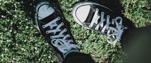 Preview wallpaper legs, sneakers, grass, flowers