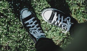 Preview wallpaper legs, sneakers, grass, flowers