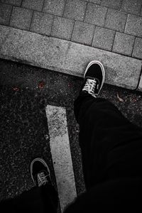 Preview wallpaper legs, sneakers, man, asphalt